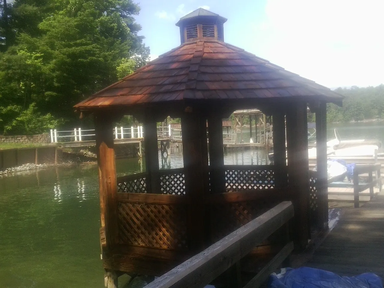 Cedar shake gazebo roof rebuilt on a lake dock in Lafayette